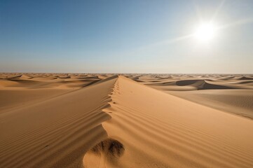 Golden sand dunes under a blazing sun in a remote desert