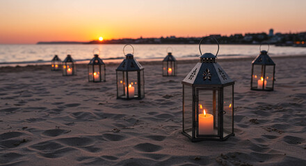 Romantic beach ceremony setup with glowing lanterns as sun sets over calm ocean waves
