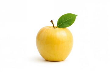 A mature yellow apple with a green leaf on a white backdrop. Sharp focus throughout.