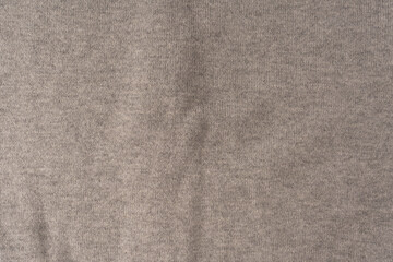Soft grey merino wool sweater texture as a background.