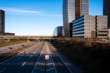 Highway and modern towers in Ørestad, Copenhagen, Denmark, urban infrastructure representing mobility, connectivity and Scandinavian city development