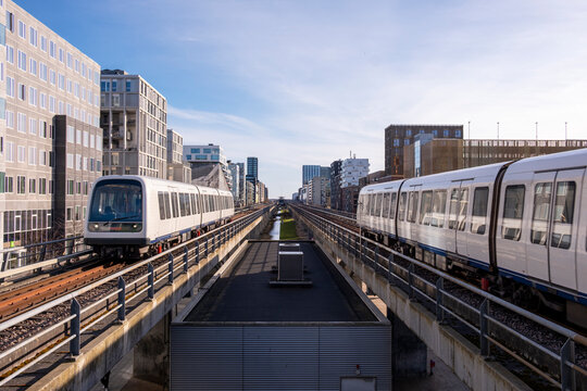 Metro train in &Oslash;restad, Copenhagen, Denmark, modern elevated transport system representing mobility, progress and innovative Scandinavian urban identity