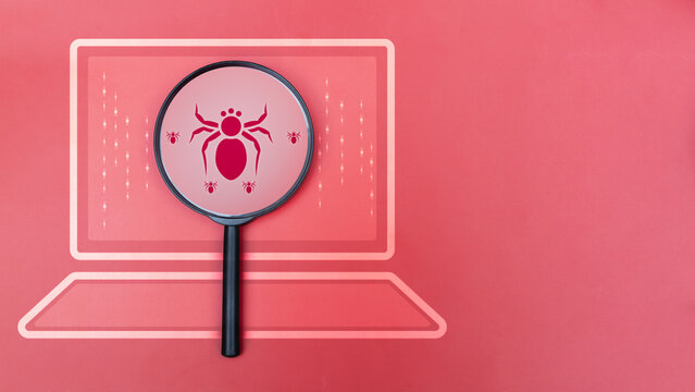 Magnifying glass showing bug icon on computer screen, concept of cybersecurity, malware detection, software testing, debugging, virus protection, IT security, and system vulnerability analysis.