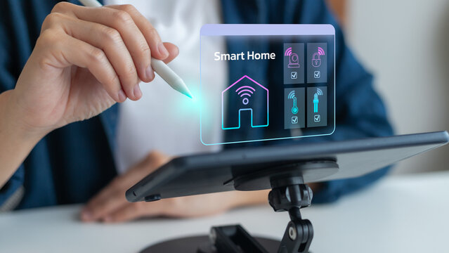 Person using tablet with smart home automation hologram, concept of IoT technology, wireless control, home security, energy management, digital lifestyle, smart devices, and modern living system.