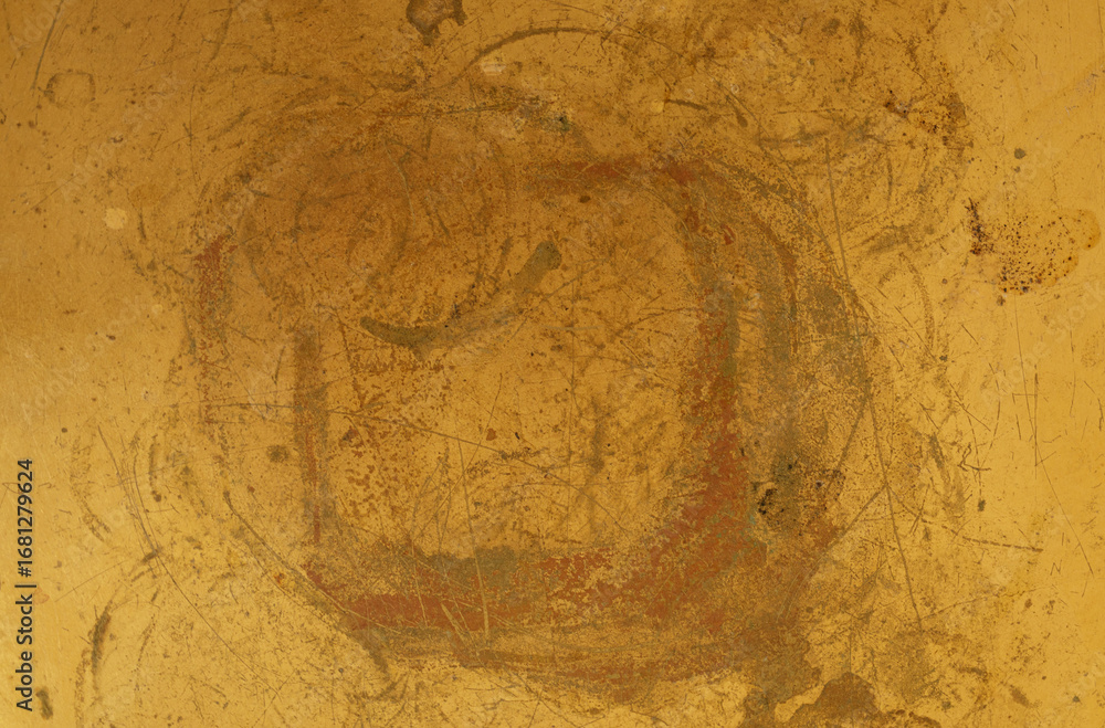 Poster high-resolution image of a golden textured background. shows a scratched, worn metal surface with ri