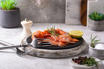 Salted sliced salmon fish with herbs