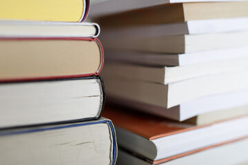 Close-up image of a stack of books, representing education, knowledge, learning, and literature....