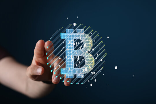 Image of a hand interacting with a digital Bitcoin symbol.  Perfect for cryptocurrency, blockchain, finance concepts.