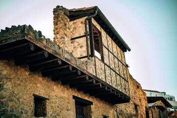 Panoramic view of ancient streets and Roman ruins in Pompeii, Italy, with stone columns and frescoed walls, ideal for travel, history, and documentary projects