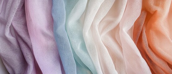 Soft pastel fabrics displayed in wavy patterns