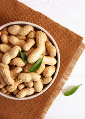 peanuts on a light background close-up. nuts. Vertical photo format