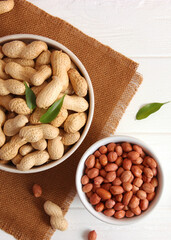 peanuts on a light background close-up. nuts. Vertical photo format