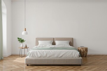 Simple bedroom design with white walls and wooden flooring featuring a bed and a lamp.