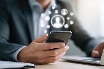 Close-up of a person in a suit using a smartphone, with a network of people icons overlaid