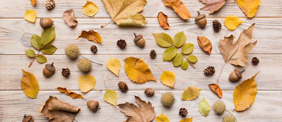 Autumn composition. Pattern made of dried leaves and other design accessories on table. Flat lay,...