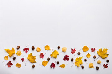 Autumn composition. Pattern made of dried leaves and other design accessories on table. Flat lay, top view