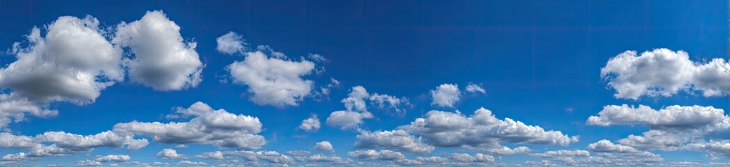 Obraz premium A vast expanse of cerulean blue sky dotted with fluffy, white cumulus clouds