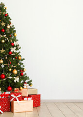 Beautiful interior decorated for Christmas or New Year.Christmas tree and gifts.. Vertical photo format