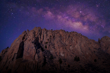 Milky Way core over mountains  and desert landscape	