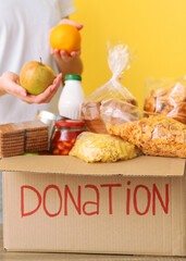 boxes with donations with the necessary things on the table. Vertical photo format