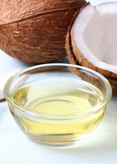 coconut oil and coconuts, palm branches close up. Vertical photo format