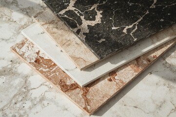 Various kitchen countertop color swatches stacked together in multiple shades