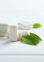 mint chewing gum and mint on the table. Fresh breath, oral care
