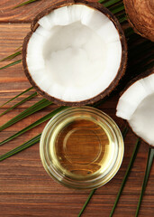 coconut oil and coconuts on the table. Vertical photo format