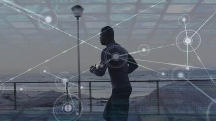 Animation of network of connections over african american man running - Powered by Adobe