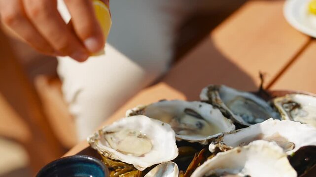 A plate of oysters with a spoon on top. Scene is appetizing and inviting