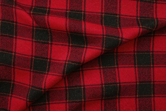 Traditional red tartan wool fabric for school uniforms. Classic seamless flannel cloth with a plaid pattern. Festive wave design ideal for holiday backgrounds or wallpapers in black, green, red, and