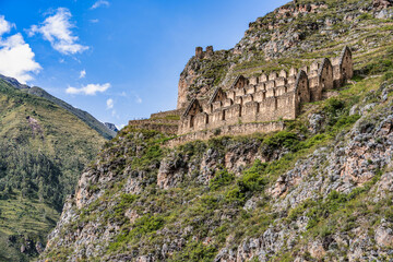 View of the Pinkuylluna Inca ruins built on the steep hillside of Ollantaytambo, in the Sacred Valley of the Incas, Peru.