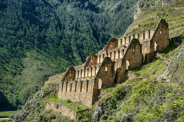 View of the Pinkuylluna Inca ruins built on the steep hillside of Ollantaytambo, in the Sacred Valley of the Incas, Peru.