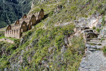 View of the Pinkuylluna Inca ruins built on the steep hillside of Ollantaytambo, in the Sacred Valley of the Incas, Peru.