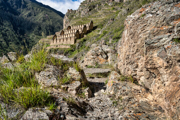 View of the Pinkuylluna Inca ruins built on the steep hillside of Ollantaytambo, in the Sacred Valley of the Incas, Peru.
