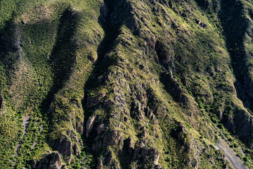 Dramatic detail view of a steep rocky mountain in Ollantaytambo, Sacred Valley, Peru.