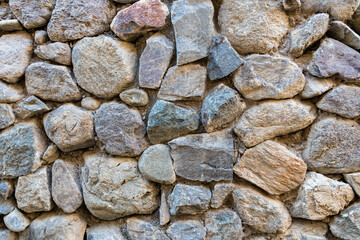 Detail of a traditional Inca stone wall with irregular rocks in Ollantaytambo, Sacred Valley, Peru.