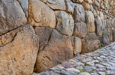 Detail view with the Inca walls made of cut stones in Ollantaytambo Sacred Valley, Peru.