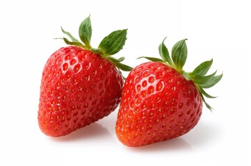 Two fresh strawberries on a plain white backdrop. Ripe and tasty fruit of the season.
