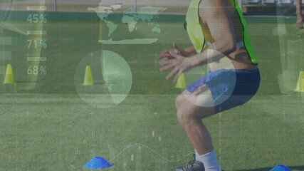 Animation of financial data and graphs over male soccer players on sport field - Powered by Adobe