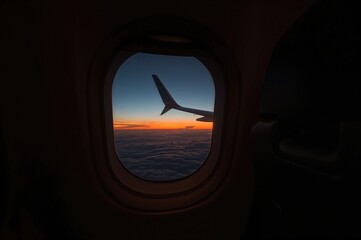 Sunset scenery from an airplane window seat