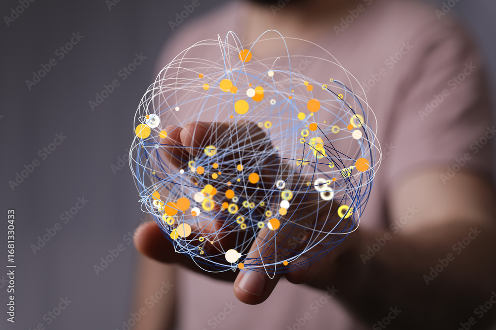 Poster person interacting with a digital sphere, representing global networking and connections.