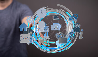 Person interacts with a digital network of icons representing technology, communication, and data.