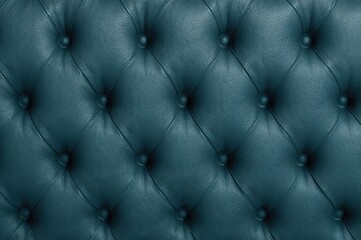 Naklejka premium Close-up of deep diamond pattern and buttons on teal blue capitone leather upholstery in vintage Chesterfield style