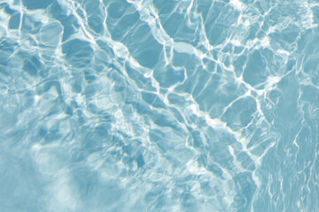 High-resolution photo of clear blue water with light reflections. Perfect for backgrounds, websites, and design projects.
