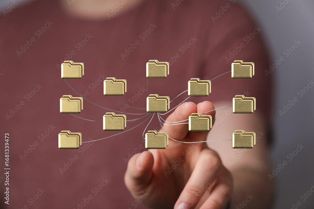 Poster person interacting with a network of digital files, showcasing data management and connectivity.