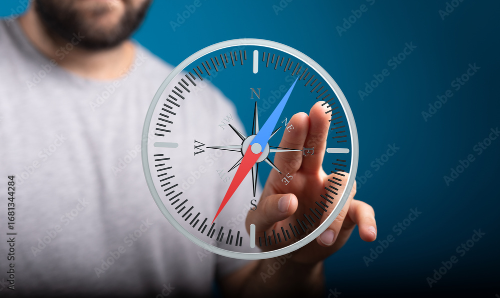 Poster person interacts with a virtual compass, exploring direction and guidance. find your way.