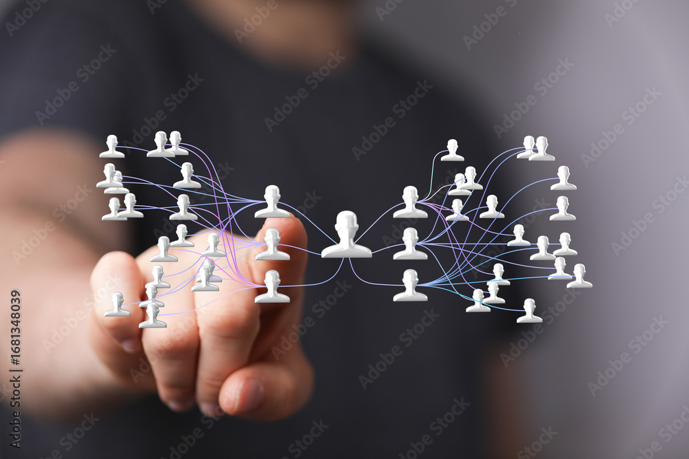 Poster image of a hand interacting with a digital network of interconnected people, symbolizing global comm