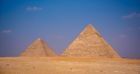 Ancient pyramids under a clear blue sky in Giza, Egypt