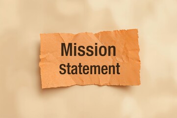 Our purpose statement displayed on a torn scrap of paper with a textured backdrop. Symbolizing the concept of our mission. Space for text.